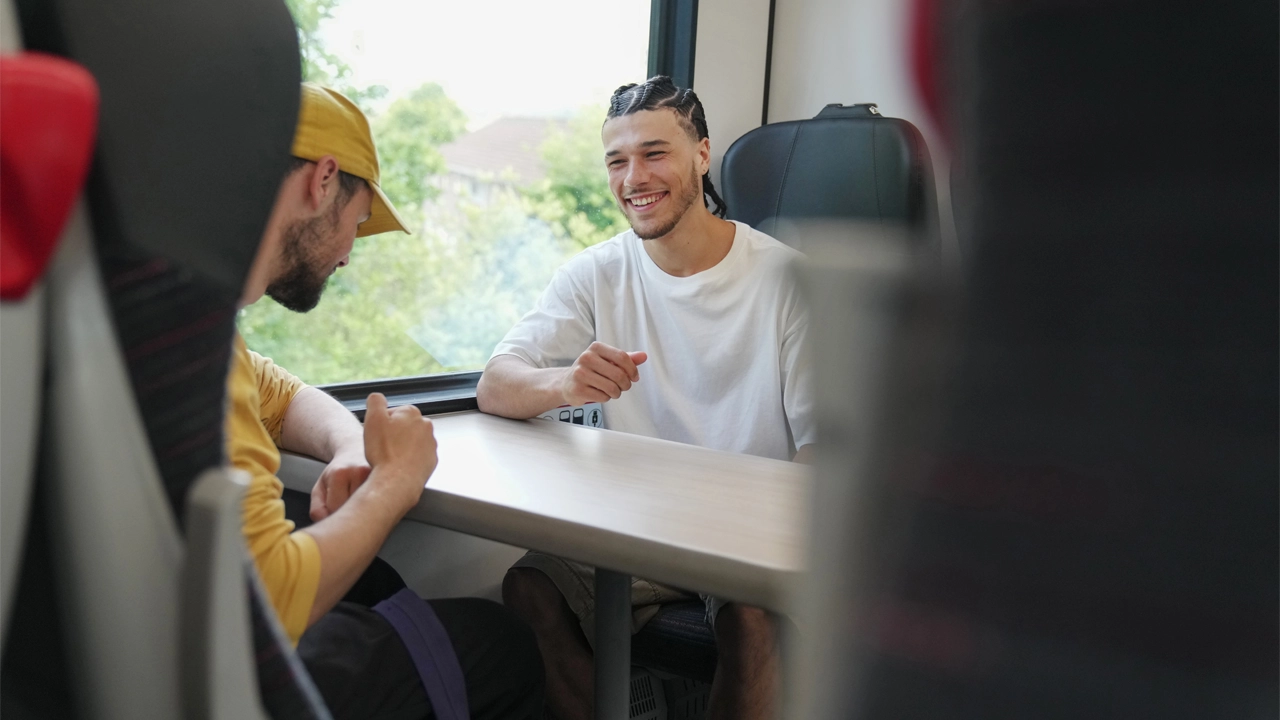 Two people taking a train journey
