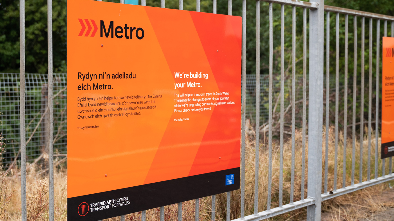 Metro sign on railing 