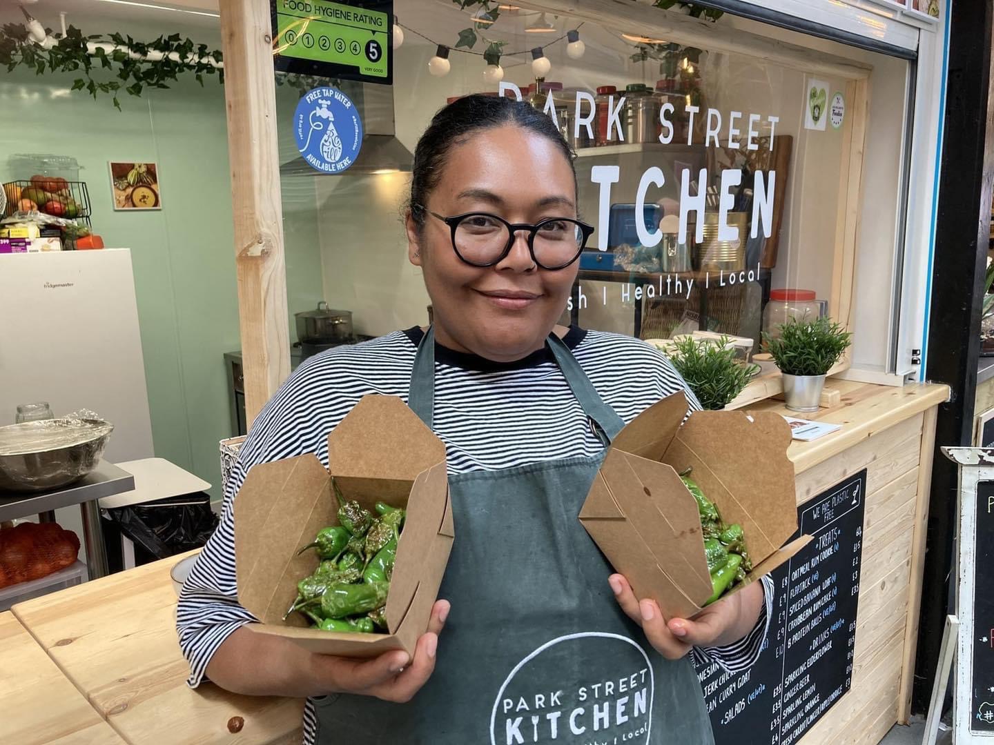 Employee holding food made at Park Street Kitchen