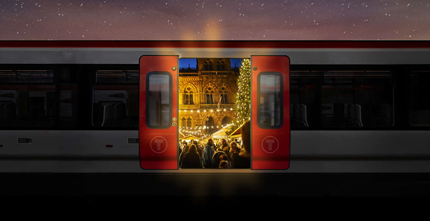 A train with open doors showcasing Chester market festivities