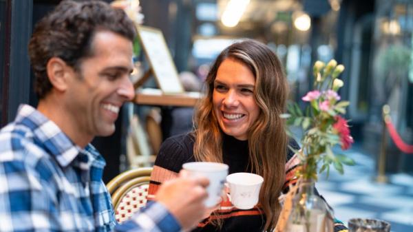 Two people enjoying hot drinks